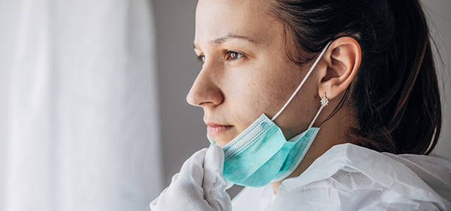 female-nurse-pulling-down-safety-mask-off-her-face--email